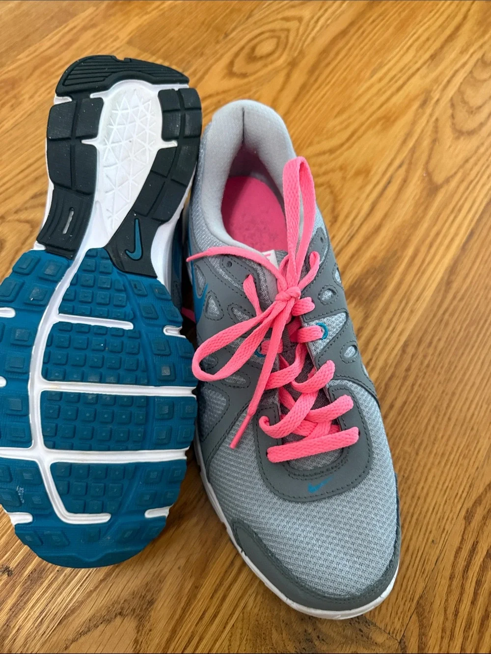 Nike Women's Gray Athletic Sneakers with Pink Laces and Blue Swoosh